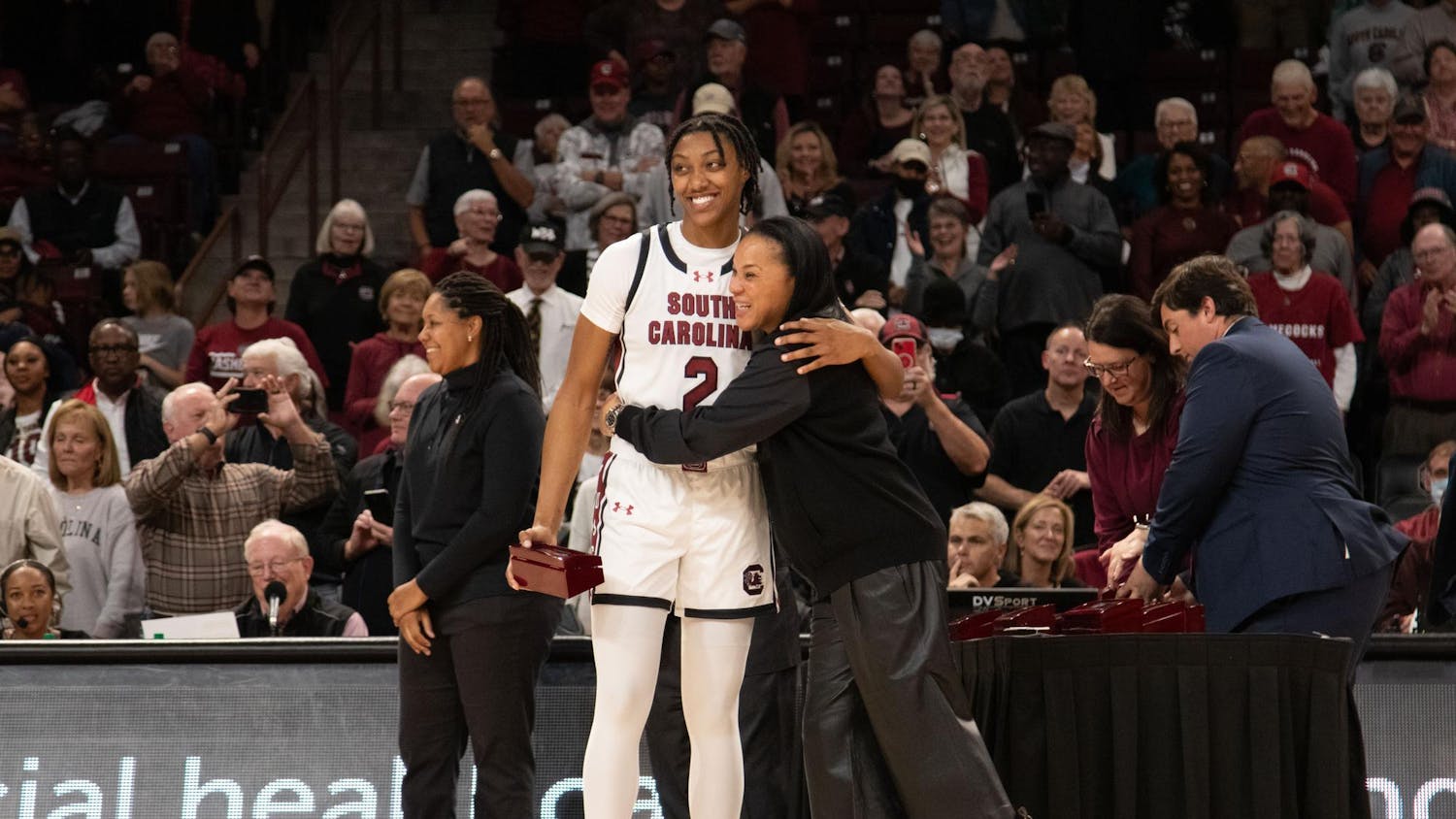 FILE — Sophomore forward Ashlyn Watkins and head coach Dawn Staley share a hug during a ring presentation ceremony for the Gamecocks' SEC Championship and Final Four appearance in the 2022-23 season. The ceremony was held at Colonial Life Arena following South Carolina's 114-76 victory over Maryland on Nov. 12, 2023.