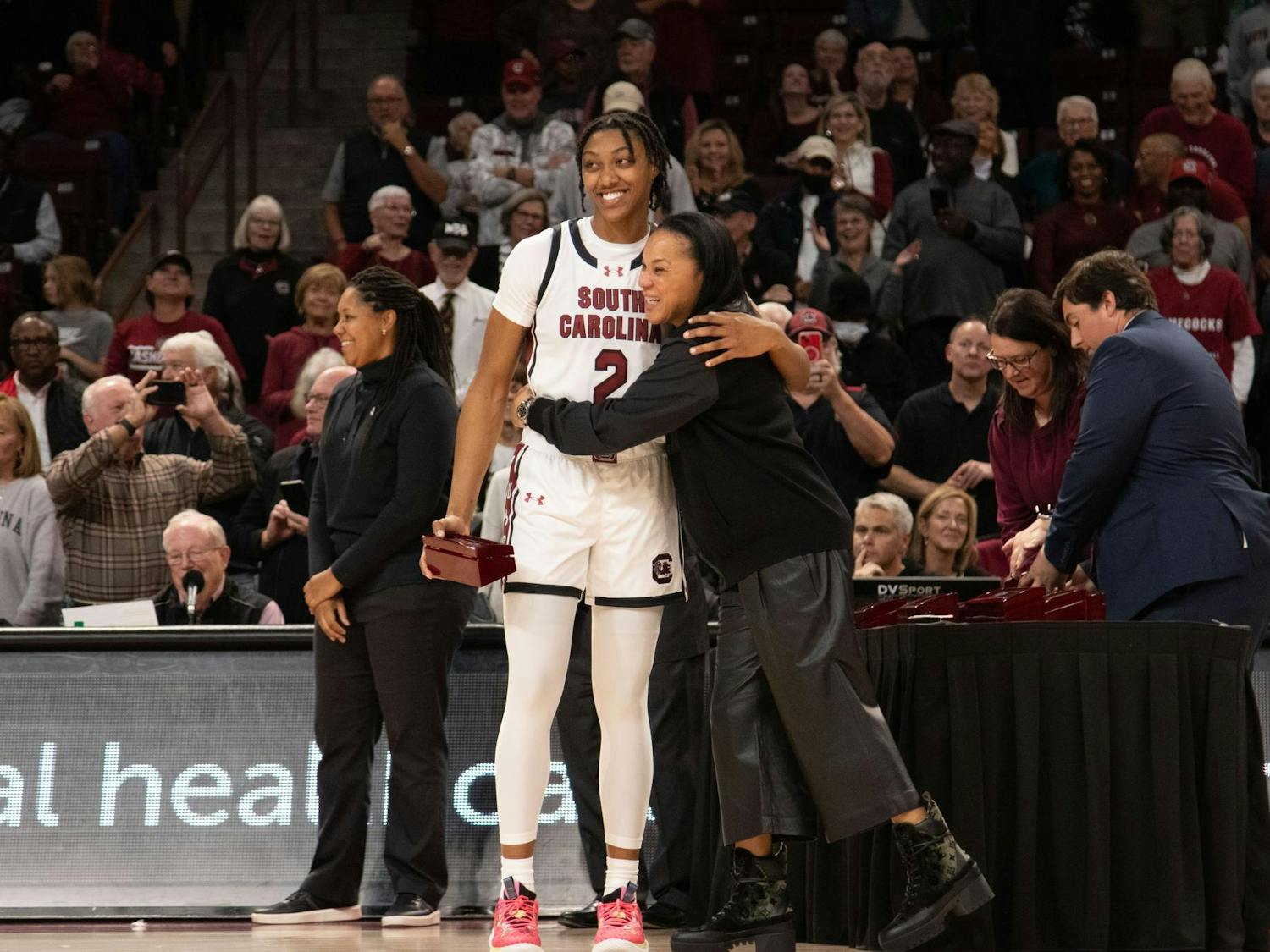 FILE — Sophomore forward Ashlyn Watkins and head coach Dawn Staley share a hug during a ring presentation ceremony for the Gamecocks' SEC Championship and Final Four appearance in the 2022-23 season. The ceremony was held at Colonial Life Arena following South Carolina's 114-76 victory over Maryland on Nov. 12, 2023.