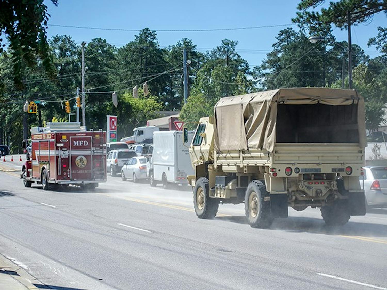 Local law enforcement and the National Guard enter the Forest Acres area on October 6. 