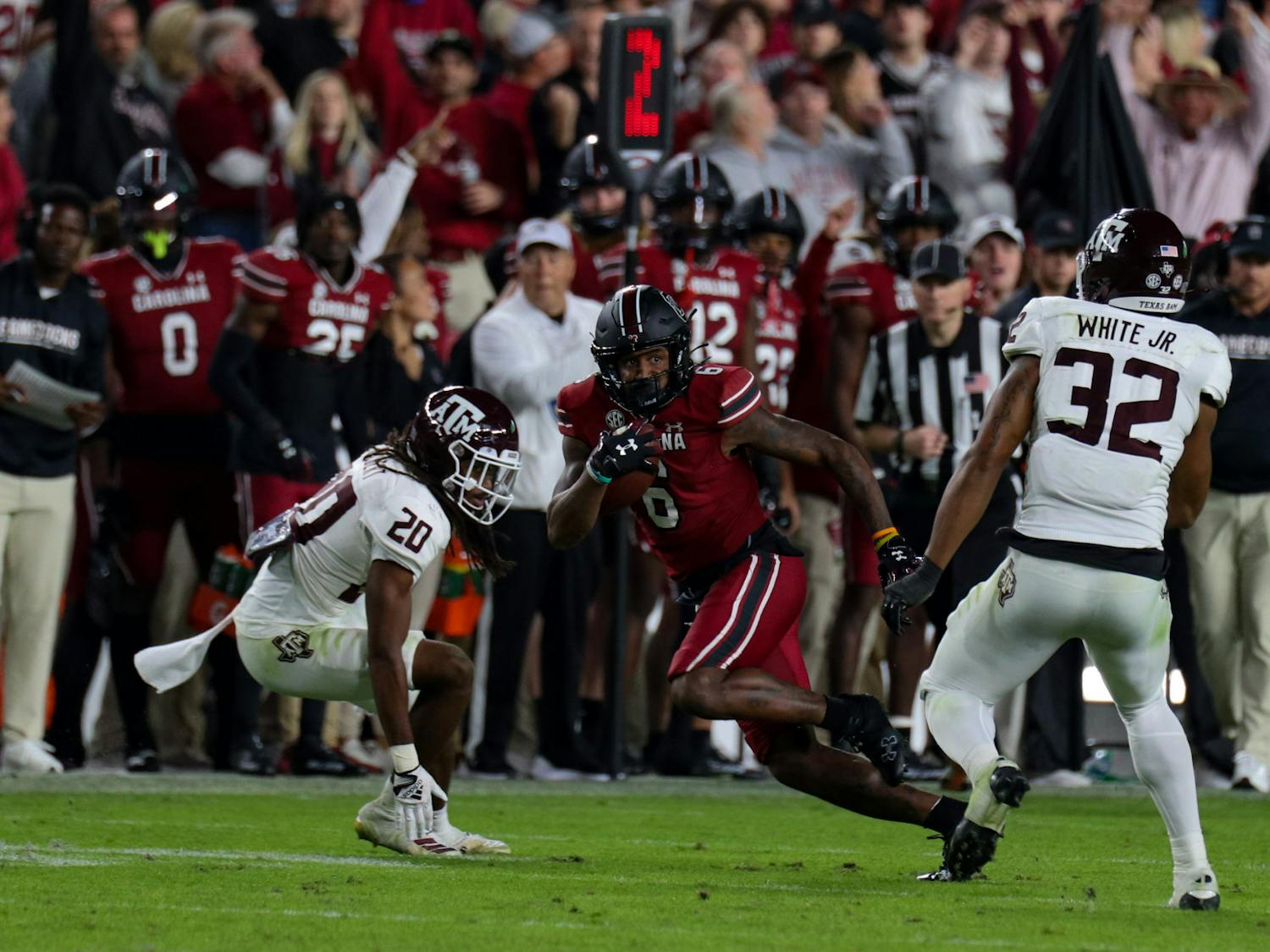 Fifth-year wide receiver Josh Vann finds the gap in between the Texas A&amp;M defenders after catching the ball in the fourth quarter in a game against the Texas A&amp;M Aggies at Williams-Brice Stadium on Oct. 22, 2022. South Carolina defeated Texas A&amp;M 30-24.