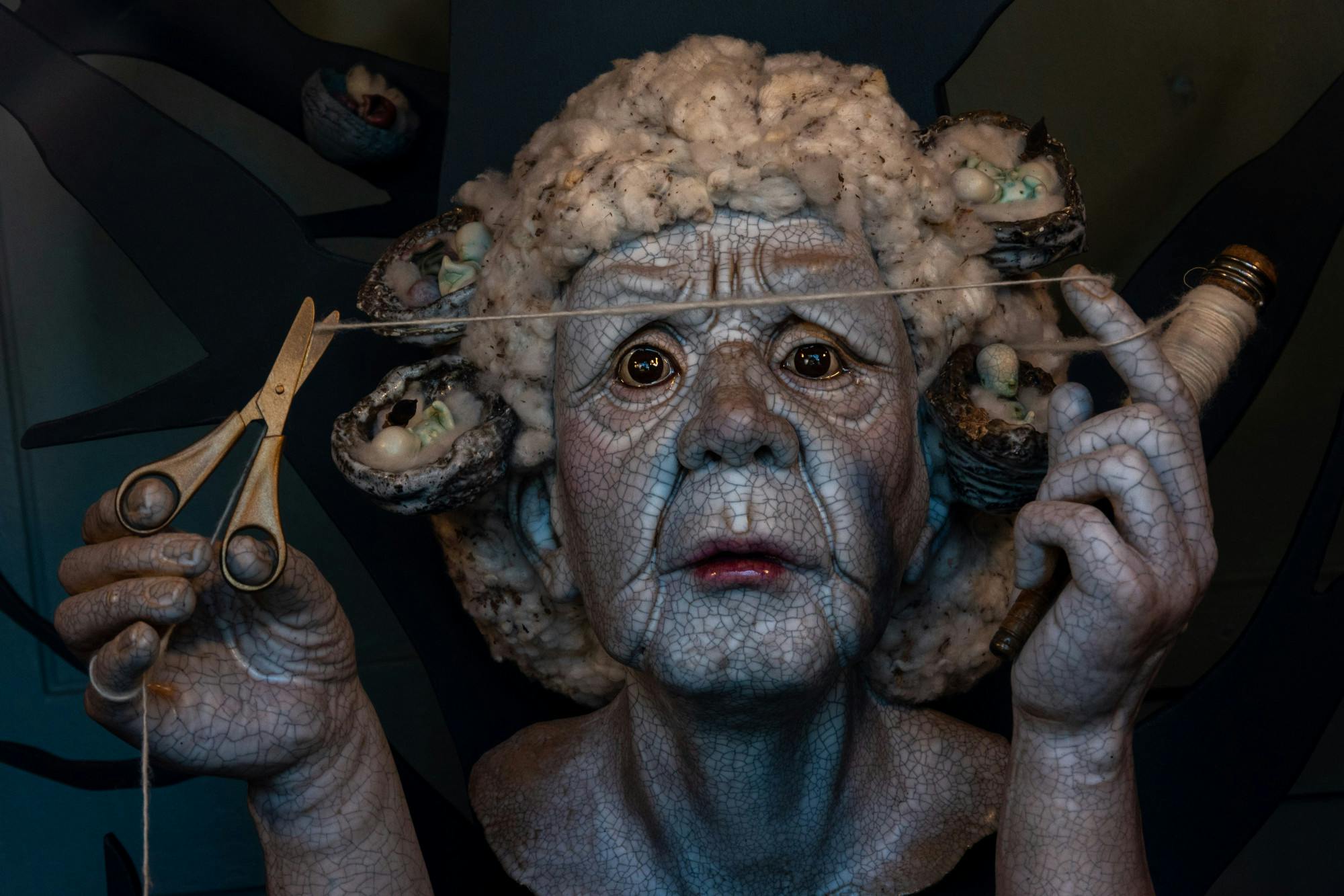 A ceramic bust of an unnamed woman cutting thread on Sept. 26, 2022. Artist Diana Farfán’s installation for the Mill District Public Art Trail features a ceramic bust of a woman who worked in the mills as part of her installation titled ‘Linthead.’