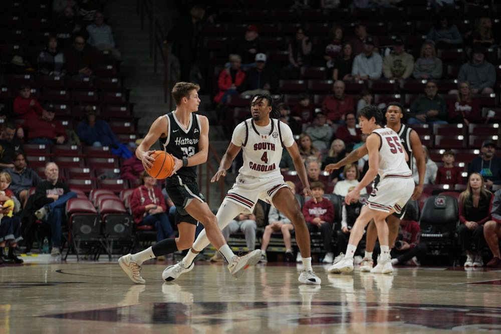 <p>A South Carolina defender guards a Stetson ball handler at the top of the key during the first half. The play unfolded at Colonial Life Arena in Columbia, South Carolina.</p>
