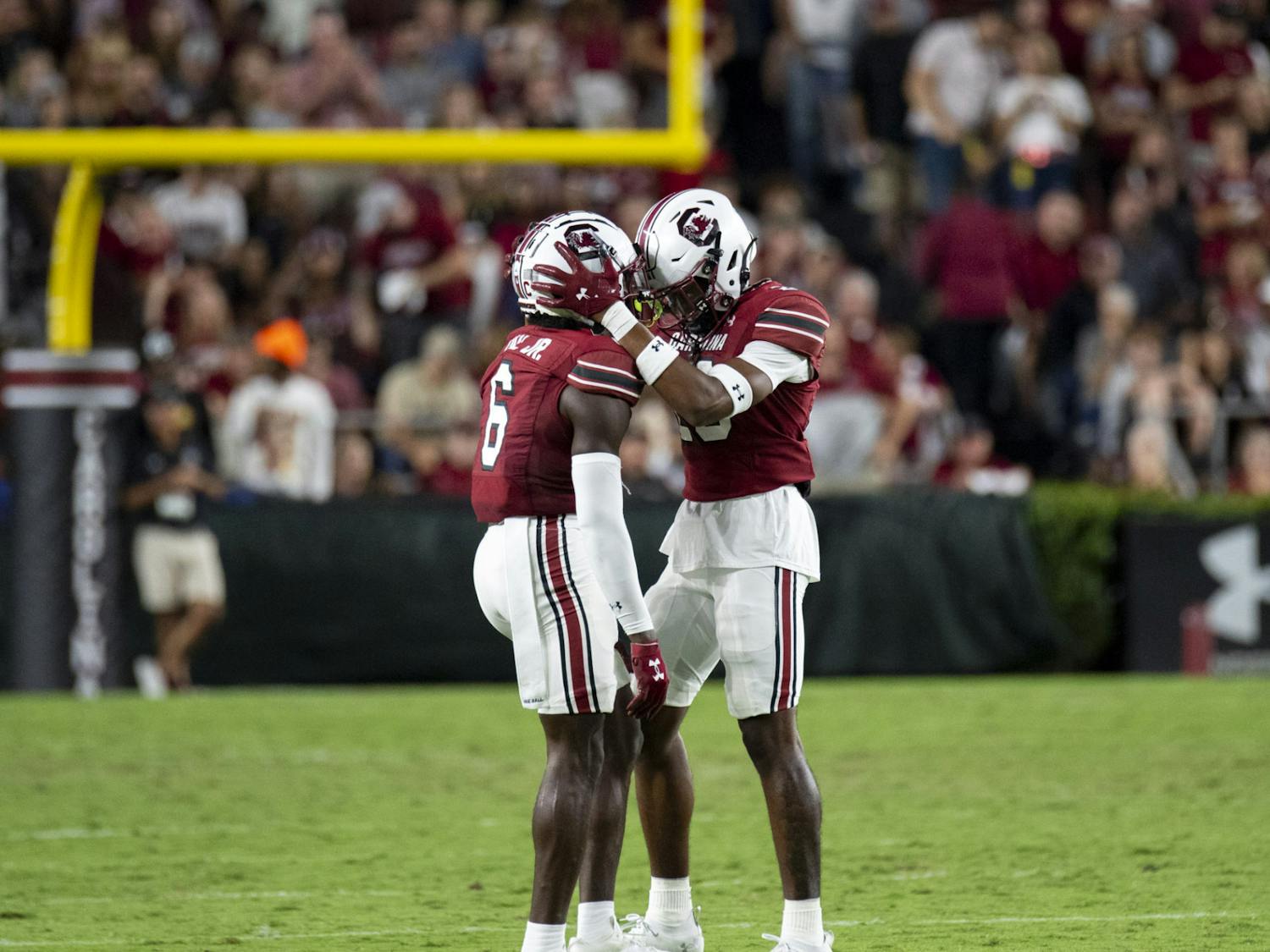 Graduate tight end Joshua Simon and redshirt freshman wide receiver Kylic Horton bring their helmets together after Simon makes an important catch in the third quarter on Sept. 23, 2023. The Gamecocks defeated the Bulldogs 37-30.