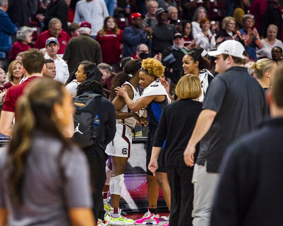 Players from Florida and South Carolina shake hands and exchange hugs after a hard-fought game at Colonial Life Arena on Feb. 16, 2023. The Gamecocks beat the Gators 87-56.
