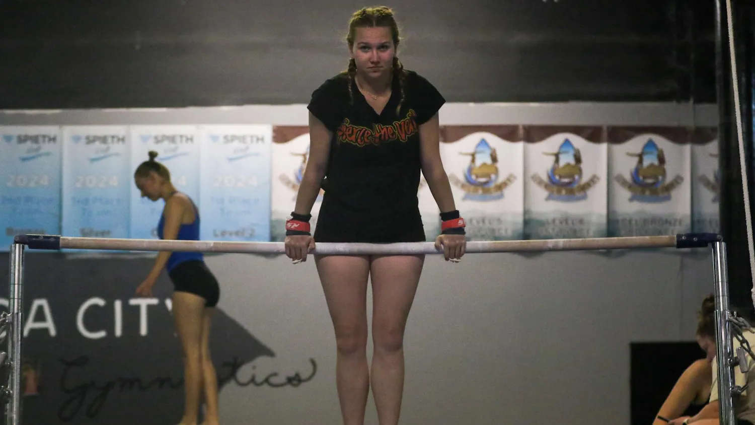 Sophomore gymnast Jaclyn Geyer balances on the uneven bars during practice at Soda City Gymnastics on March 31, 2026. The South Carolina Club Gymnastics team is competing at the National Association of Intercollegiate Gymnastics Clubs National Championships from April 8-11 in Birmingham, Alabama.
