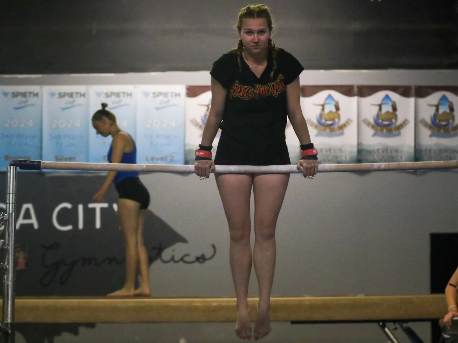 Sophomore gymnast Jaclyn Geyer balances on the uneven bars during practice at Soda City Gymnastics on March 31, 2026. The South Carolina Club Gymnastics team is competing at the National Association of Intercollegiate Gymnastics Clubs National Championships from April 8-11 in Birmingham, Alabama.