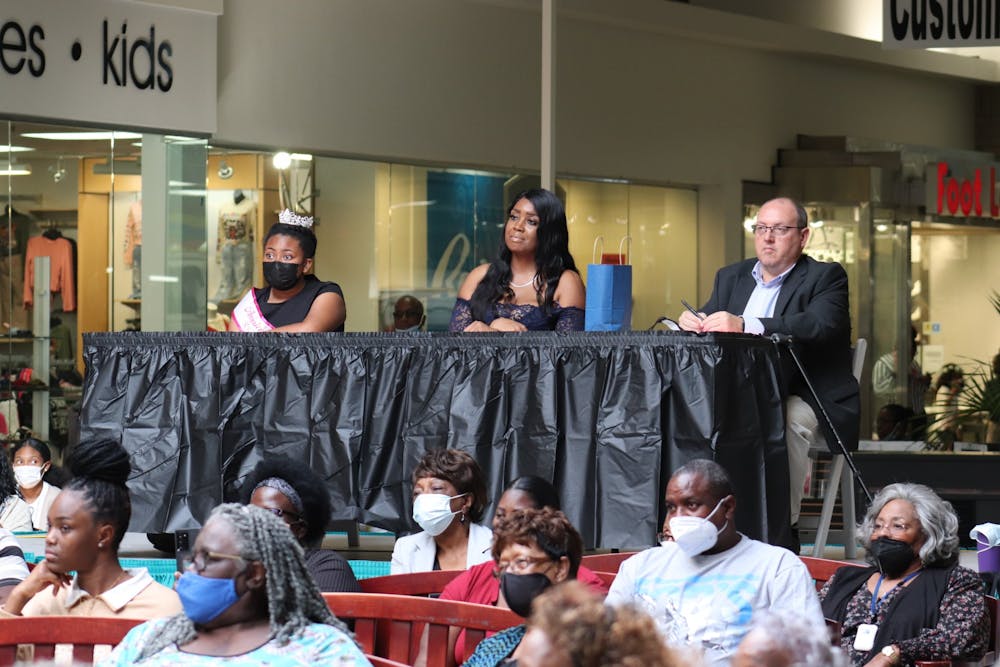 <p>The three judges of the 2021 Ms. Senior Recreation Pageant sit in the back and tally points for each competitor based on stage presence, personality and articulation, among other things.&nbsp;</p>