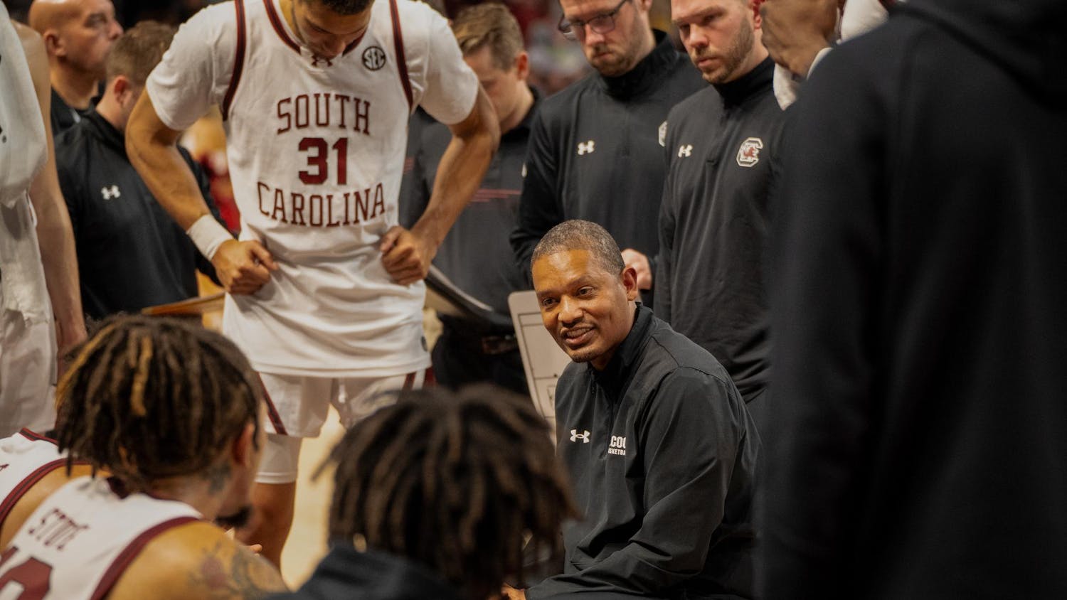Men's basketball head coach Lamont Paris talks to his players on Nov. 13 during their 74-64 victory over Virginia Military Institute. During his seventh season as a collegiate head coach, Paris has led the Gamecocks to a 13-1 start.