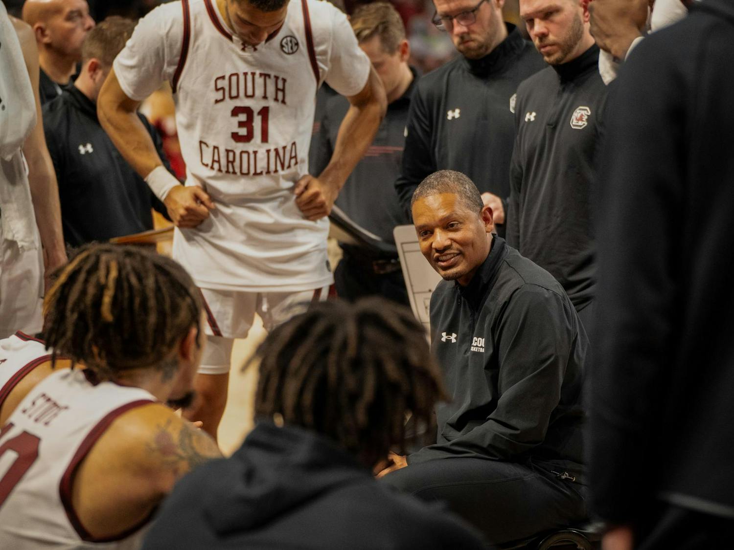 Men's basketball head coach Lamont Paris talks to his players on Nov. 13 during their 74-64 victory over Virginia Military Institute. During his seventh season as a collegiate head coach, Paris has led the Gamecocks to a 13-1 start.