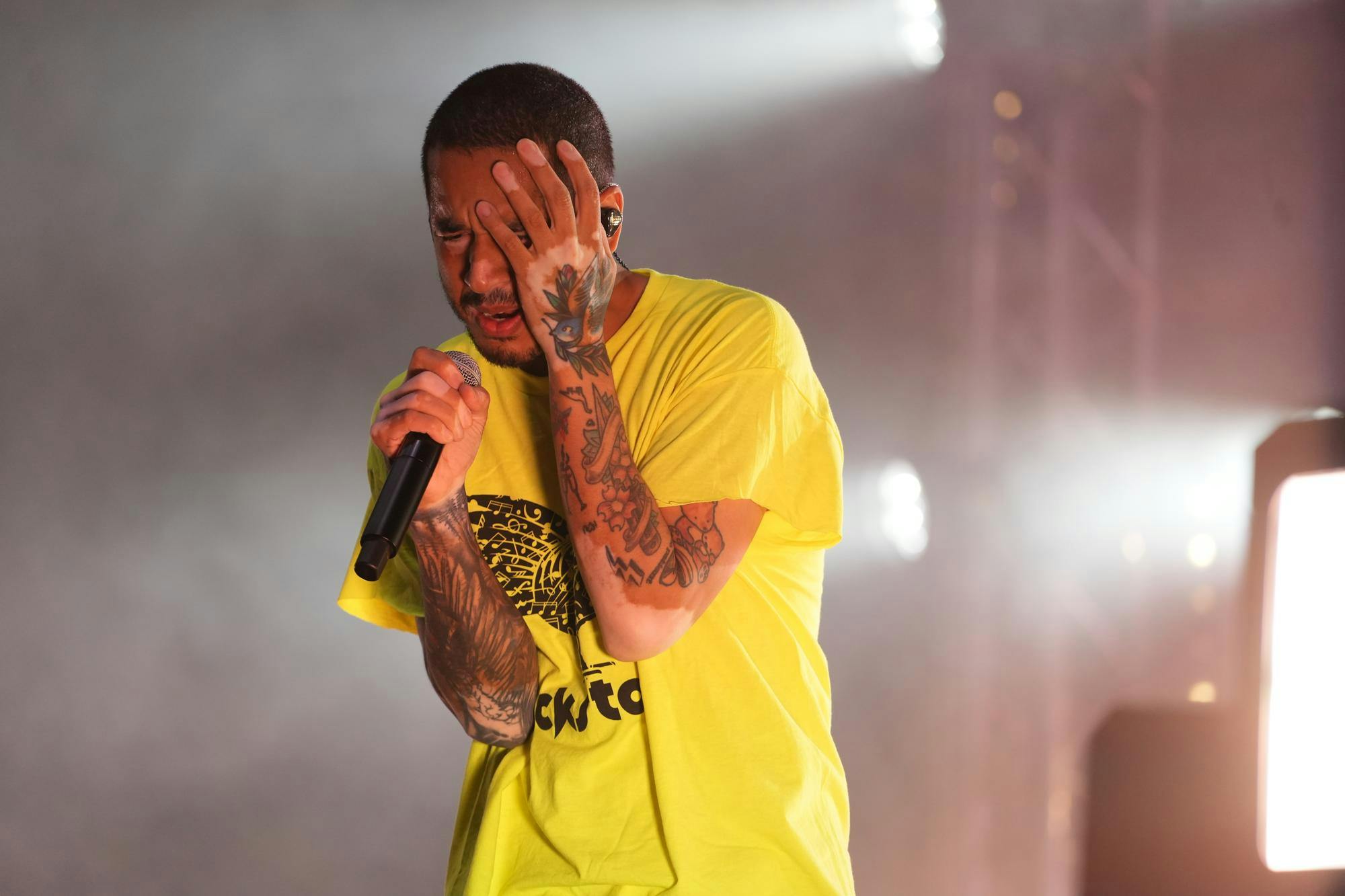 Michael “Mikey” Foster of Social House performs on stage during Cockstock on March 24, 2026 at Blatt Field in Columbia, South Carolina. Foster sings during an evening set, engaging the crowd under bright stage lighting.