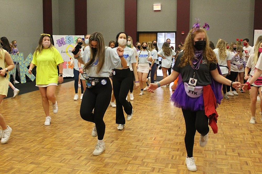 Dance Marathon attendees and volunteers doing the "Cha Cha Slide."