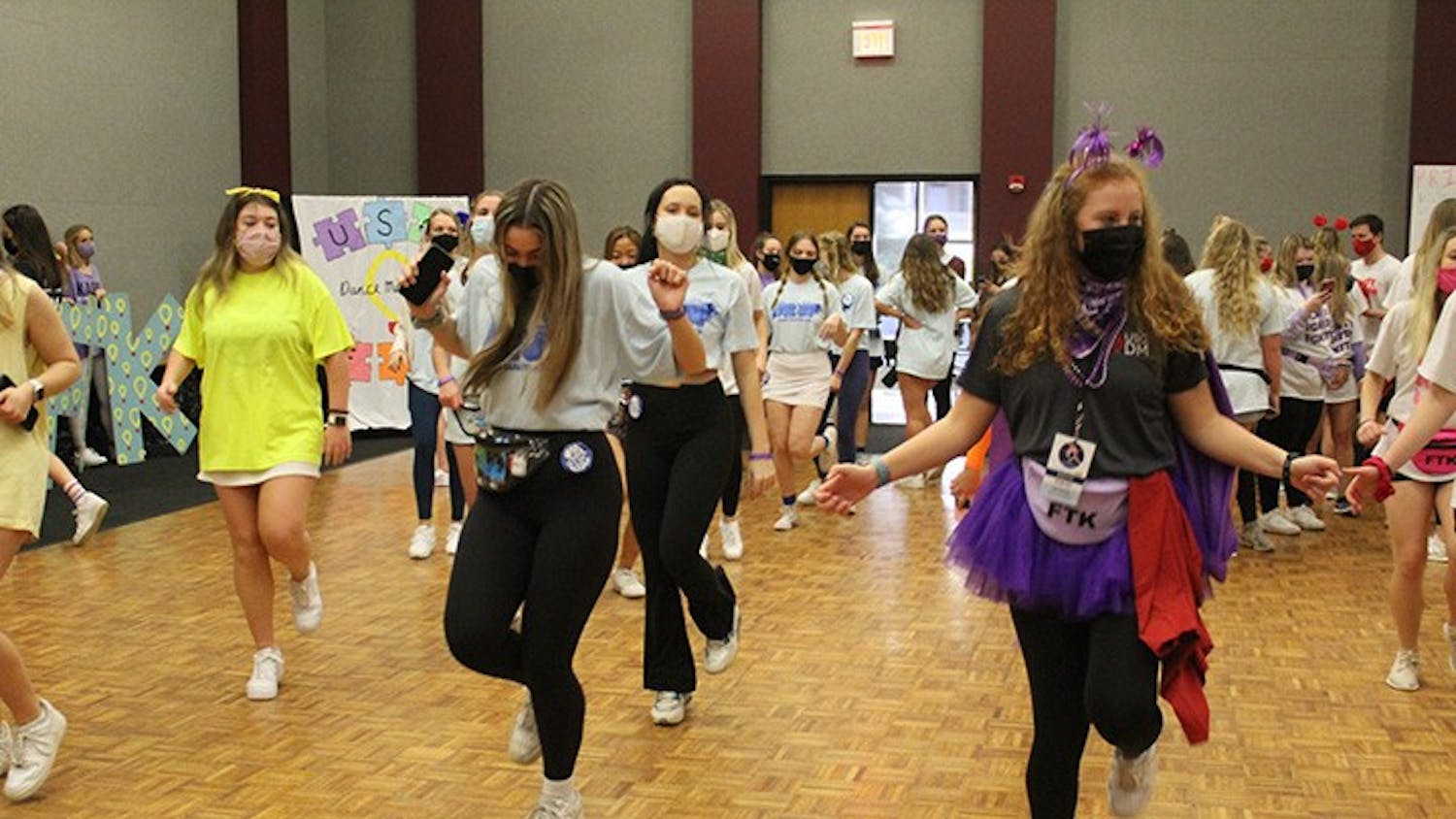 Dance Marathon attendees and volunteers doing the "Cha Cha Slide."