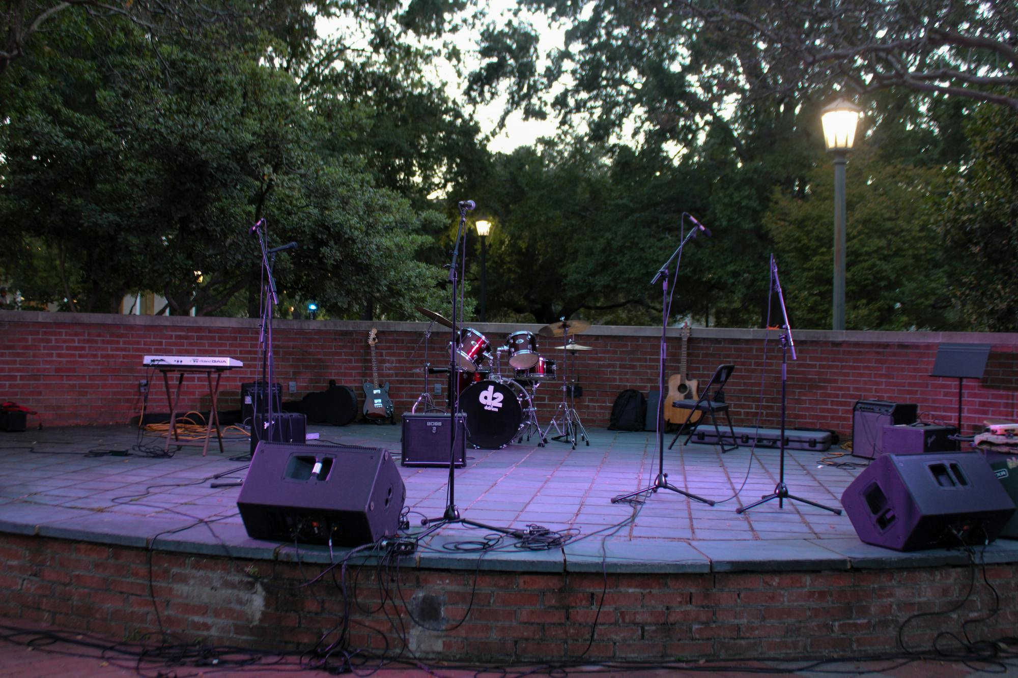 Microphones and sound equipment sit on an empty stage minutes before the Battle of the Bands concert event on Oct. 5, 2022. The competition brought a cappella, folk, rap and rock to the Russell House Patio in a variety of performances.
