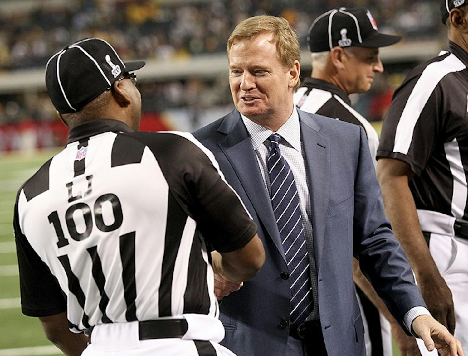 Commissioner of the National Football League, Roger S. Goodell, meets with line judge Tom Symonette (100) before the start of Super Bowl XLV where the Green Bay Packers face the Pittsburgh Steelers at Cowboys Stadium in Arlington, Texas, Sunday, February 6, 2011. (Ron Jenkins/Fort Worth Star-Telegram/MCT)
