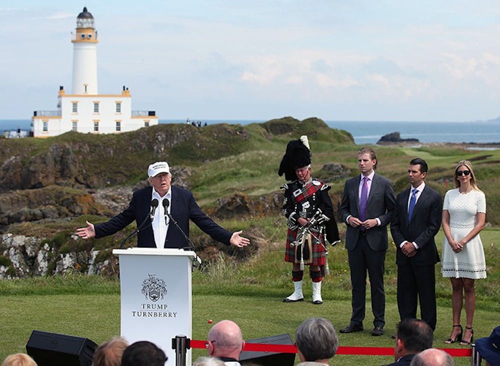 From right, Ivanka, Donald Jr.and Erik Trump listen as their father, US presidential hopeful Donald Trump, speaks at Turnberry hotel in South Ayrshire, where the Trump Turnberry golf course has been revamped, on June 24, 2016. (Andrew Milligan/PA Wire/Abaca Press/TNS) 