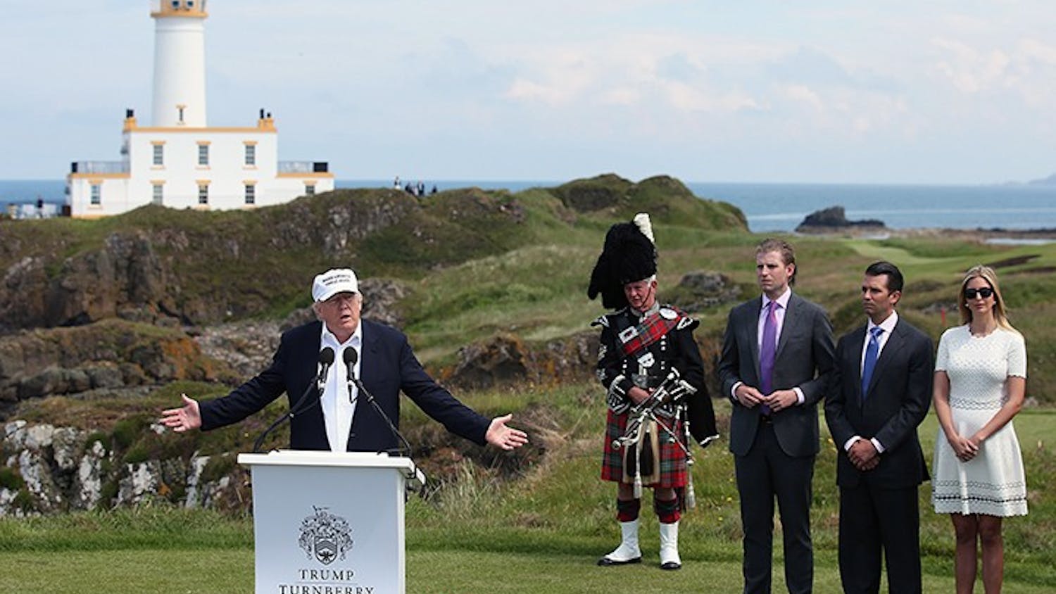 From right, Ivanka, Donald Jr.and Erik Trump listen as their father, US presidential hopeful Donald Trump, speaks at Turnberry hotel in South Ayrshire, where the Trump Turnberry golf course has been revamped, on June 24, 2016. (Andrew Milligan/PA Wire/Abaca Press/TNS) 