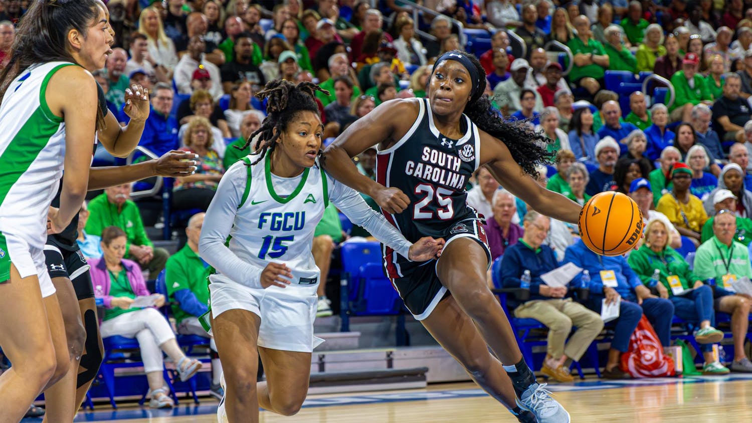 FILE — Senior guard Raven Johnson drives the ball down the court while flanked by an opposing player during the game at Florida Gulf Coast University on Dec. 20, 2025. The Gamecocks defeated the Eagles 105-43
