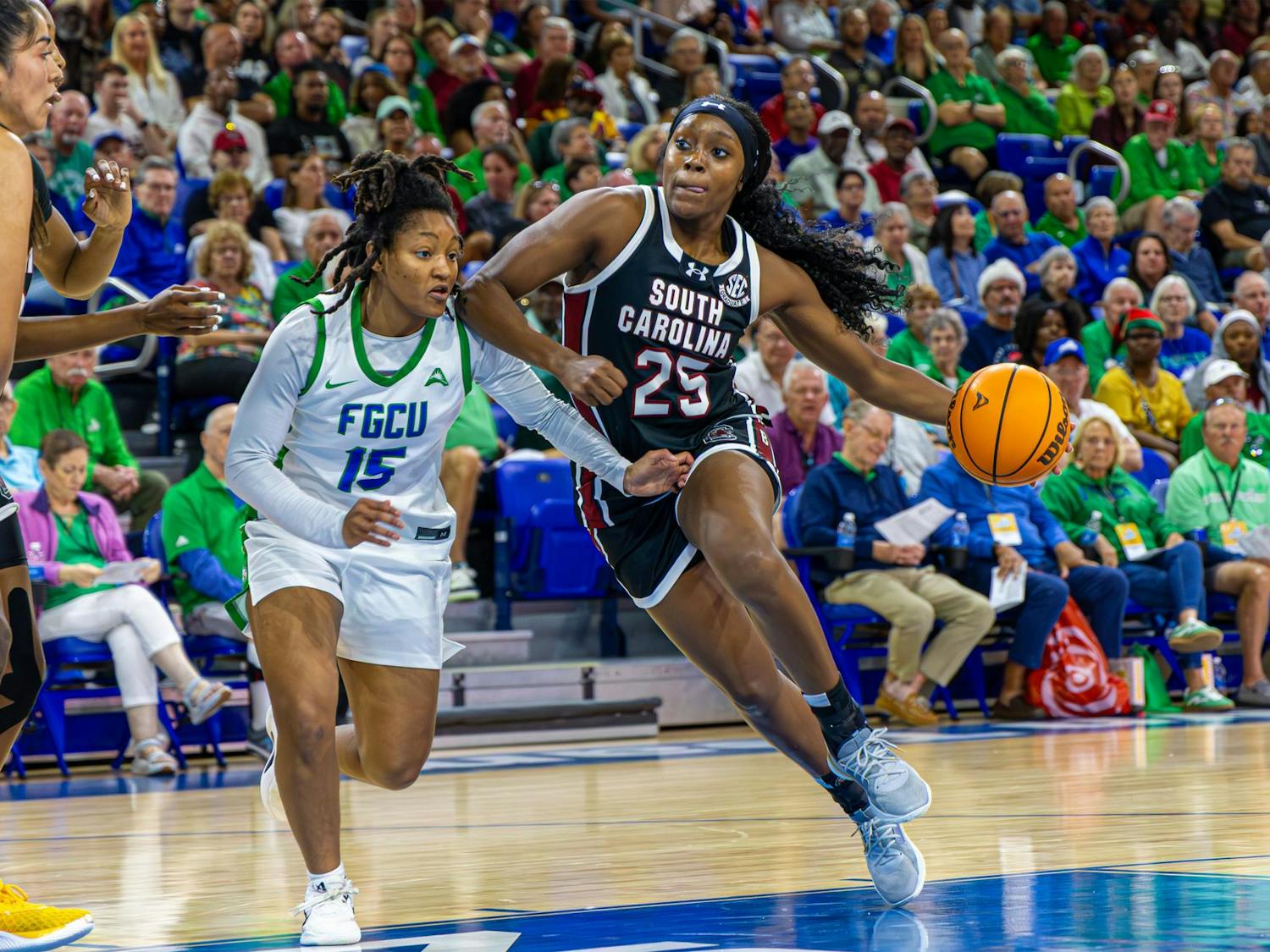 FILE — Senior guard Raven Johnson drives the ball down the court while flanked by an opposing player during the game at Florida Gulf Coast University on Dec. 20, 2025. The Gamecocks defeated the Eagles 105-43