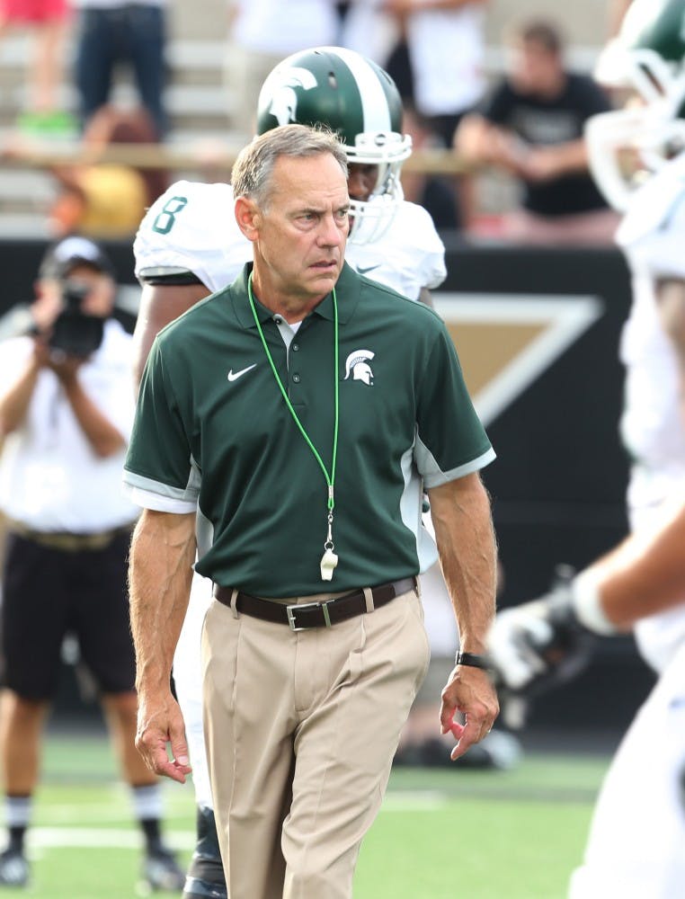 Michigan State head coach Mark Dantonio watches his team warm up before action against Western Michigan at Waldo Stadium in Kalamazoo, Mich., on Friday, Sept. 4, 2015. (Kirthmon F. Dozier/Detroit Free Press/TNS)