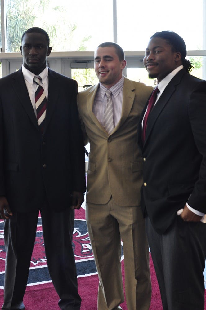 	Gamecock athletes from a range of USC sports teams walk the red carpet before the 2013 Gamecock Gala awards ceremony at Colonial Life Arena Monday evening.