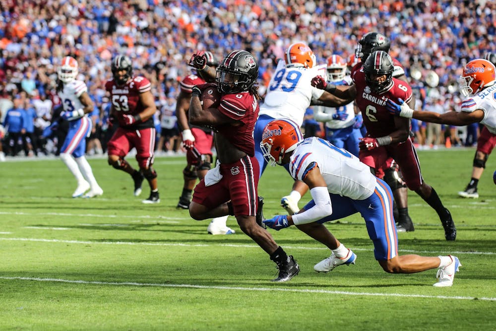 <p>FILE — Junior running back Juju McDowell carries the ball toward the endzone during South Carolina’s game against Florida on Oct. 14, 2023, at Williams-Brice Stadium. McDowell scored one touchdown and averaged 17 rushing yards in the Gamecocks’ 41-39 loss to the Gators.</p>
