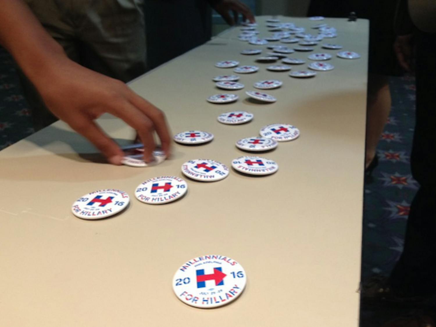 Delegates pick up Millennials for Hillary campaign buttons on their way into the youth council meeting at the Democratic National Convention in Philadelphia on July 27, 2016.