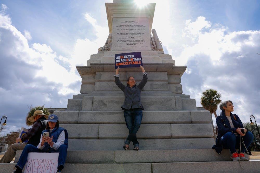 <p>A woman holds a sign above her head reading "UNELECTED UNACCOUNTABLE UNACCEPTABLE" during a protest on the grounds of the South Carolina Statehouse on March 4, 2025. Protesters gathered around the capitol grounds to oppose a new state bill that would ban all abortions with no exceptions for rape or incest.</p>