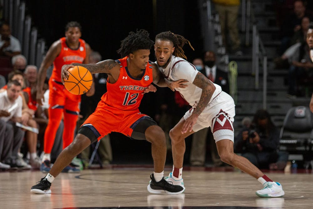 <p>Graduate guard James Reese V works to cover his opponent in a game against Auburn earlier this season. Reese was the only player to score double digits against Tennessee.&nbsp;</p>
