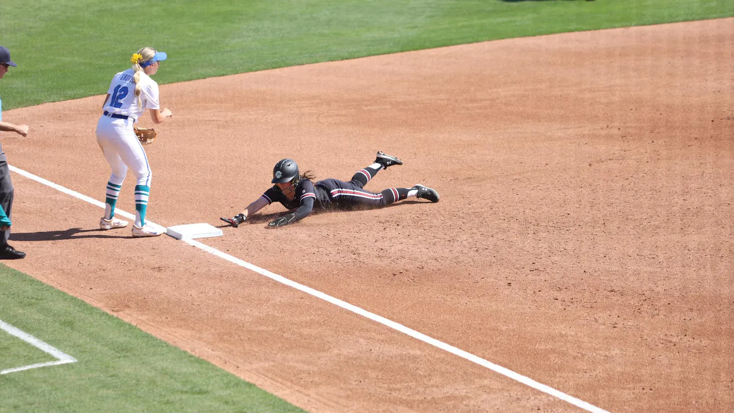 A South Carolina player slides safely into third base against Florida on April 11, 2026, at Beckham Field. The Gamecocks lost 15-2 to the Gators.