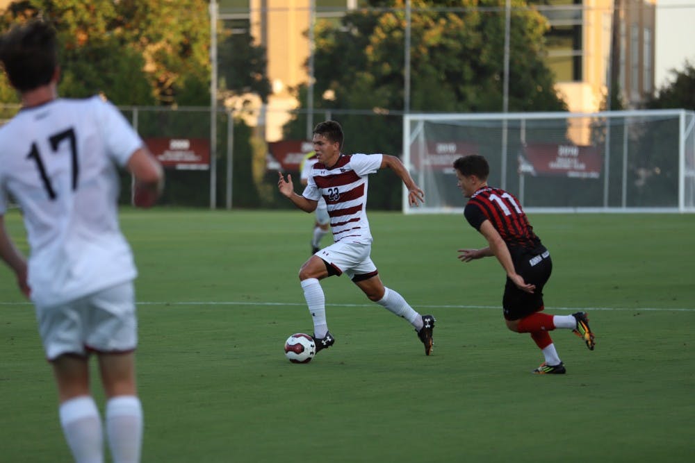Sophomore Elijah Bebout takes the ball down the field in the Gamecocks' match against Gardner-Webb on Tuesday evening.