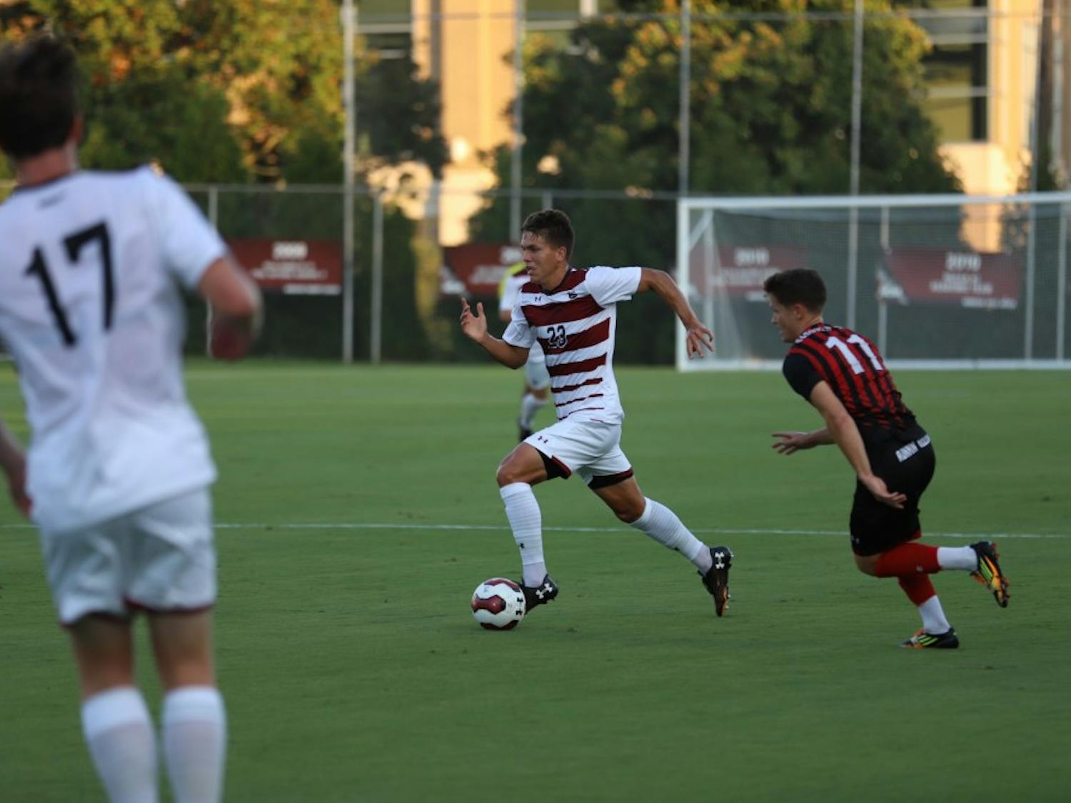 Sophomore Elijah Bebout takes the ball down the field in the Gamecocks' match against Gardner-Webb on Tuesday evening.