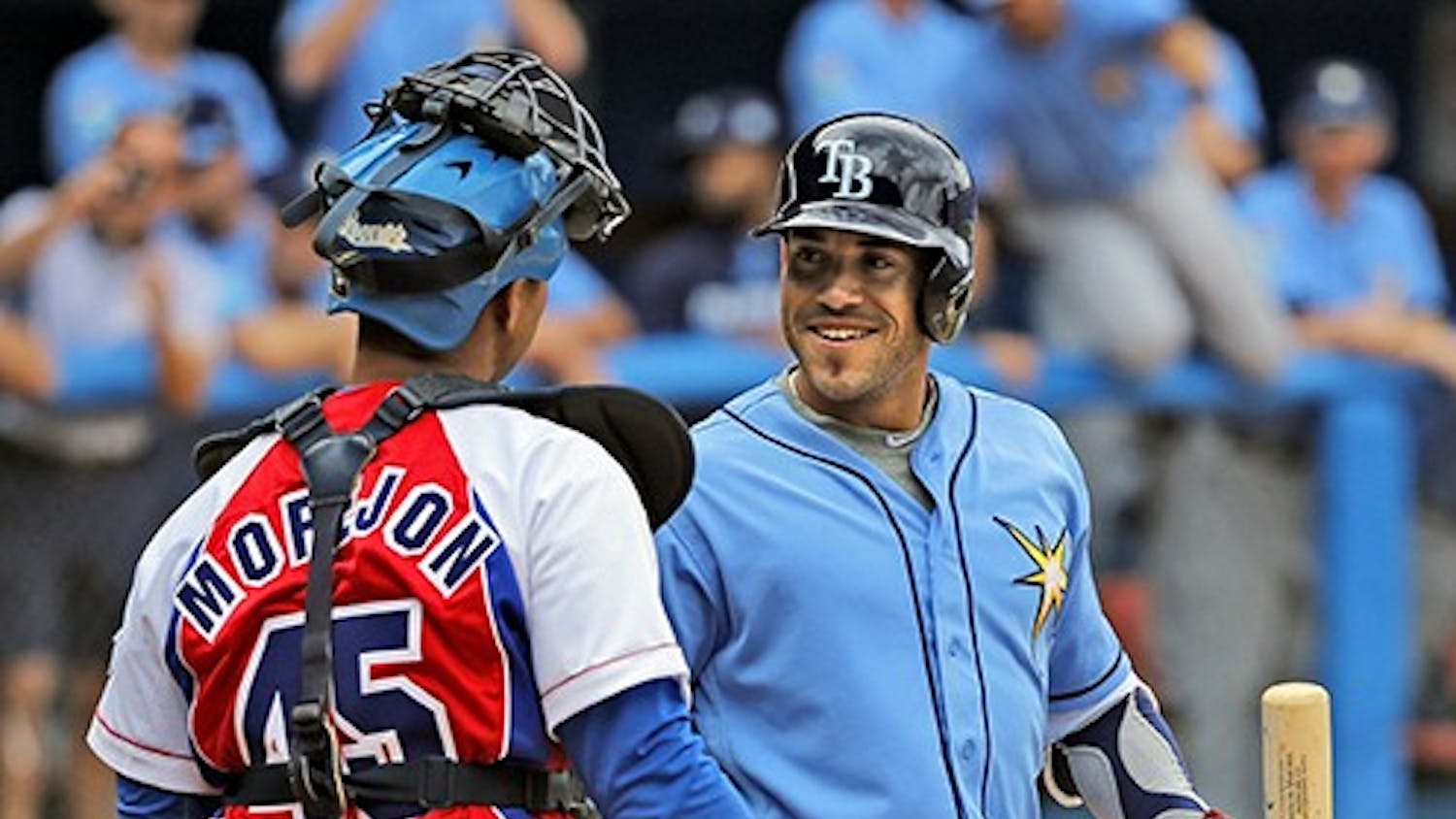 Cuban-Born Tampa Bay Rays Outfielder Dayron Varona is greeted by Cuban catcher Frank Camilo Morejon Reyes during game at the Estadio Latinoamericano between the Tampa Bay Rays and the Cuban National team on March 22, 2016 in Havana, Cuba. (Al Diaz/Miami Herald/TNS) 