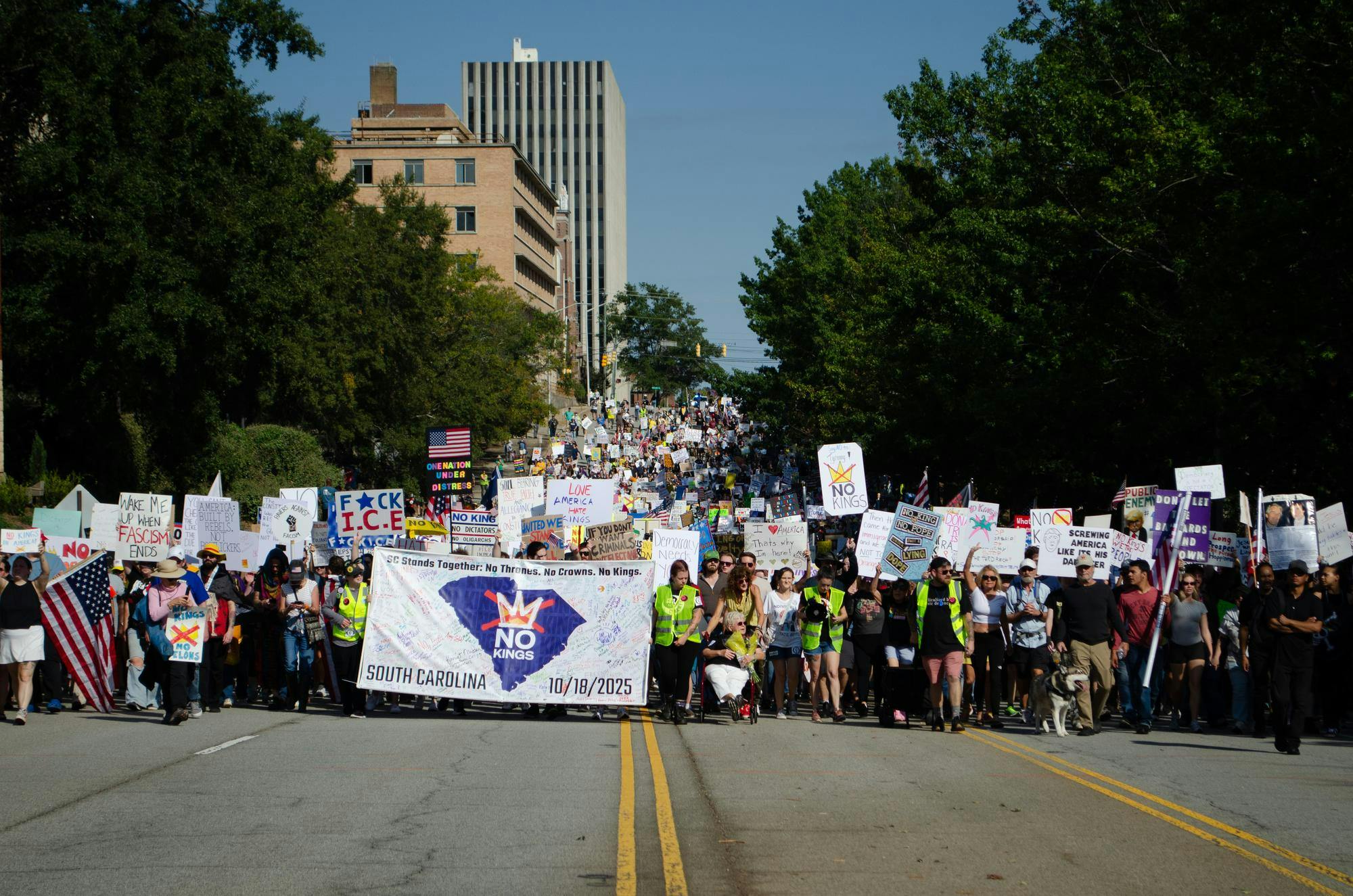 A crowd of protesters march to the governor’s mansion during a "No Kings" protest in Columbia, South Carolina on Oct. 18, 2025. While not officially associated with any political party, the "No Kings" protests are opposed to Donald Trump and those aligned with him in the Republican Party, including South Carolina Governor Henry McMaster.