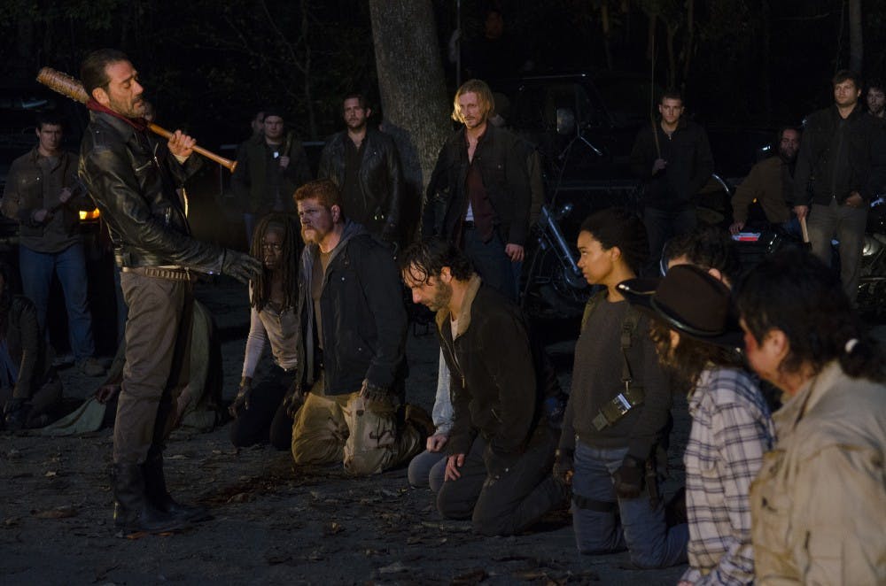 Negan (Jeffrey Dean Morgan) stands before Michonne (Danai Gurira), Abraham (Michael Cudlitz), Maggie (Lauren Cohan), Rick (Andrew Lincoln) and Sasha (Sonequa Martin-Green), Carl (Chandler Riggs) and Eugene (Josh McDermitt) during the final cliffhanger scene of season six of AMC's "The Walking Dead." (Gene Page/AMC)