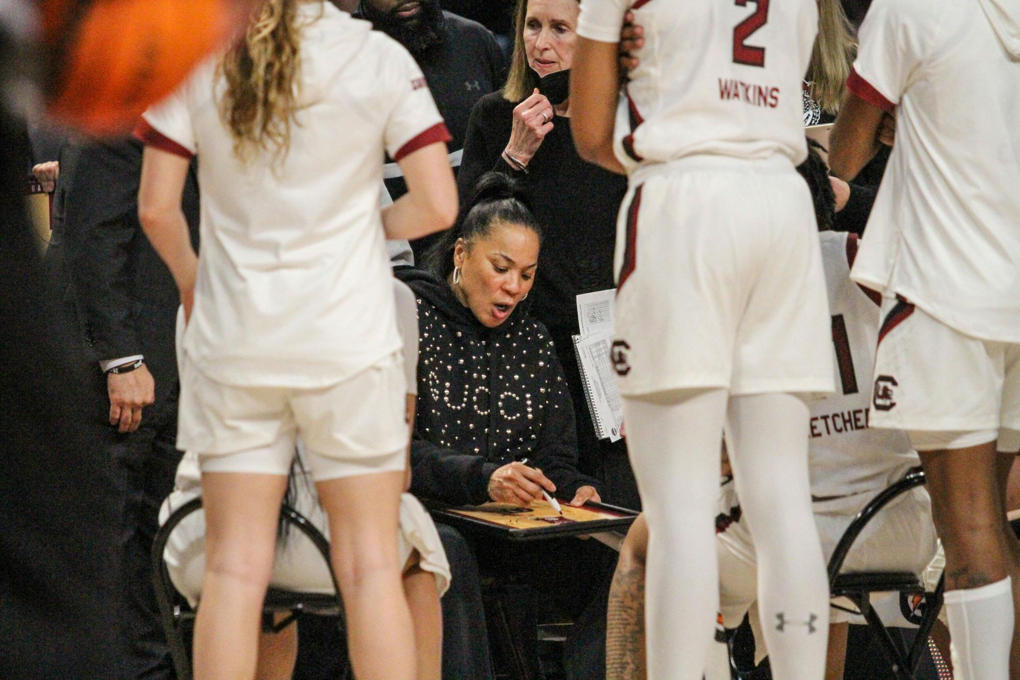 Head coach Dawn Staley draws up a play during a time out at South Carolina’s game against Georgia at Colonial Life Arena on Feb. 26, 2023. The Gamecocks beat the Bulldogs 73-63.