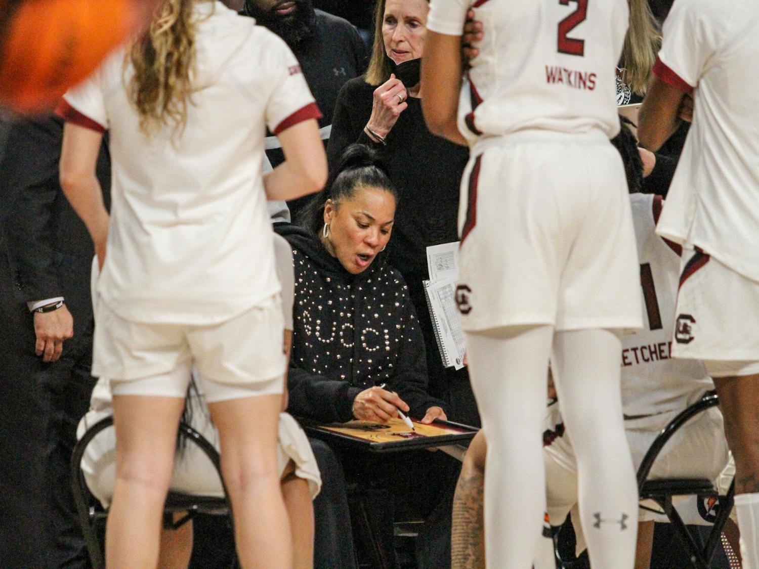 Head coach Dawn Staley draws up a play during a time out at South Carolina’s game against Georgia at Colonial Life Arena on Feb. 26, 2023. The Gamecocks beat the Bulldogs 73-63.
