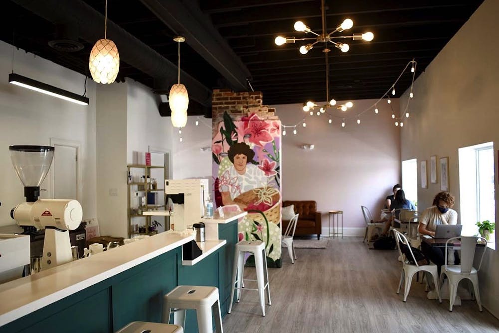 <p>The interior of Azalea Coffee Bar, a chic new woman-owned establishment on Devine Street. The mural is of owner Brittany Koester's mother, and contributes to the shop's goal of uplifting women and reducing disparities in the industry.&nbsp;&nbsp;&nbsp;</p>