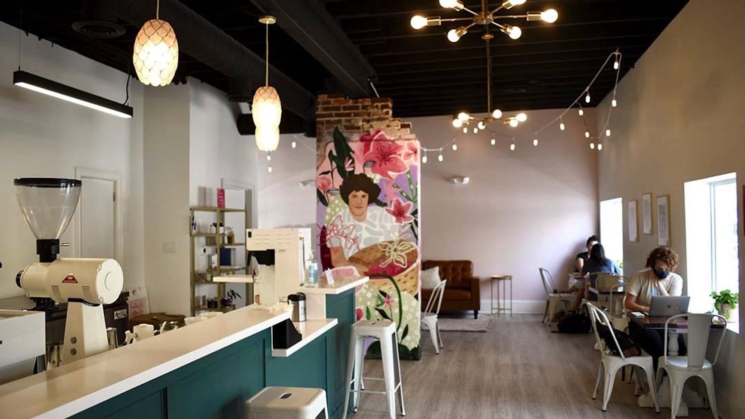 The interior of Azalea Coffee Bar, a chic new woman-owned establishment on Devine Street. The mural is of owner Brittany Koester's mother, and contributes to the shop's goal of uplifting women and reducing disparities in the industry.&nbsp;&nbsp;&nbsp;