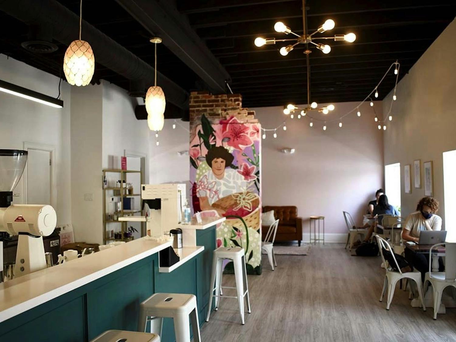 The interior of Azalea Coffee Bar, a chic new woman-owned establishment on Devine Street. The mural is of owner Brittany Koester's mother, and contributes to the shop's goal of uplifting women and reducing disparities in the industry.&nbsp;&nbsp;&nbsp;