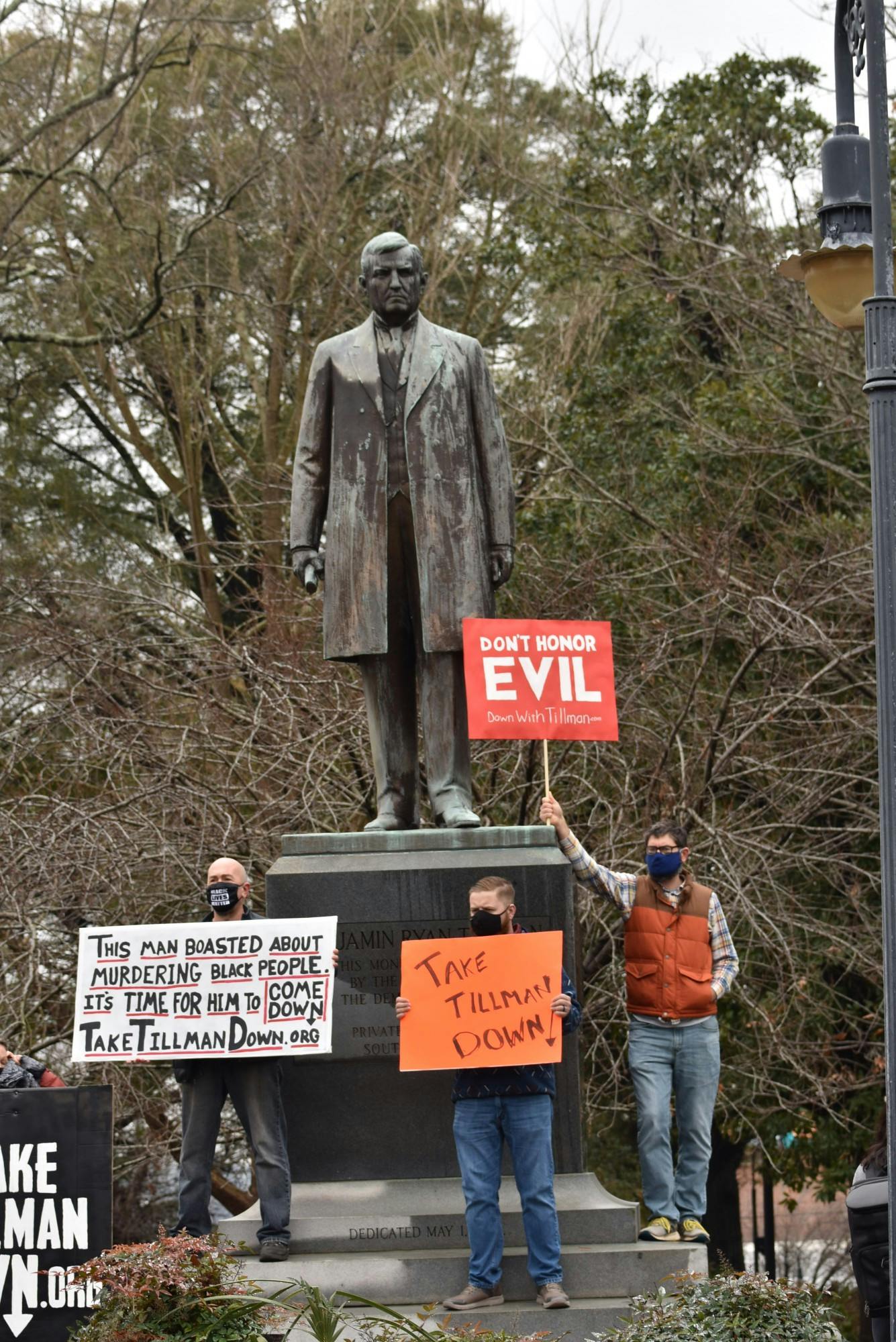 Protestors stand in front of the Benjamin Tillman statue located at the South Carolina Statehouse. The protestors called for the removal of the statue based on Benjamin Tillman's history.