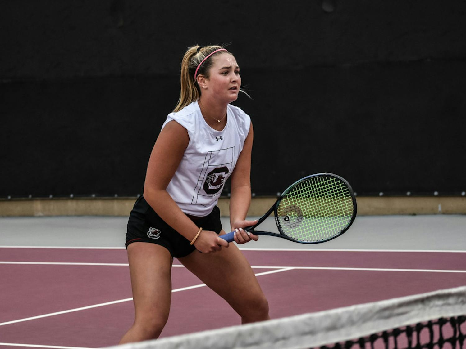Freshman Alice Otis watches the ball on Kentucky's side of the court during the match on March 17, 2023. The Gamecocks won the match 4-3 and sit at 7-6 for the season.