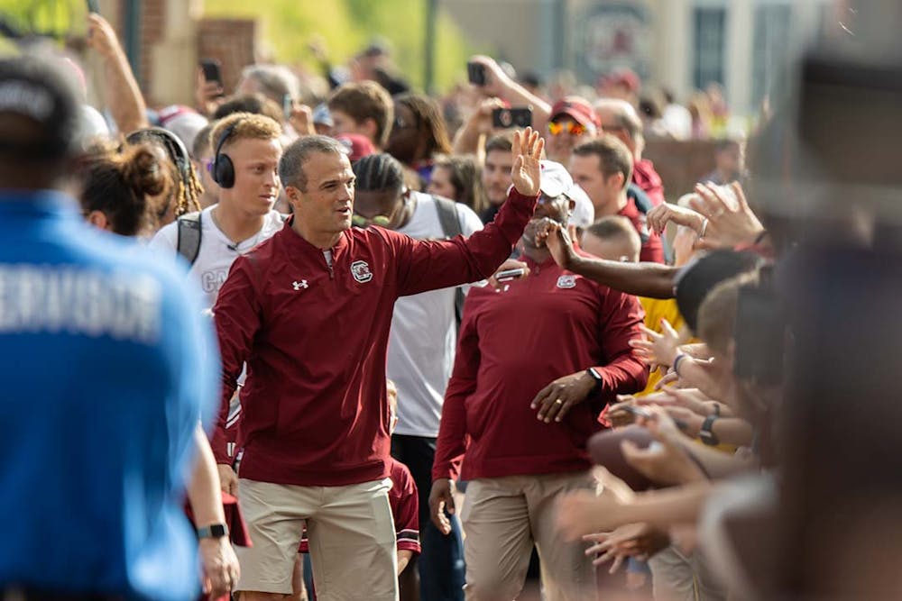 FILE — Head football coach Shane Beamer greets fans during the Gamecock Walk prior to the Garnet and Black Spring game on April 16, 2022.