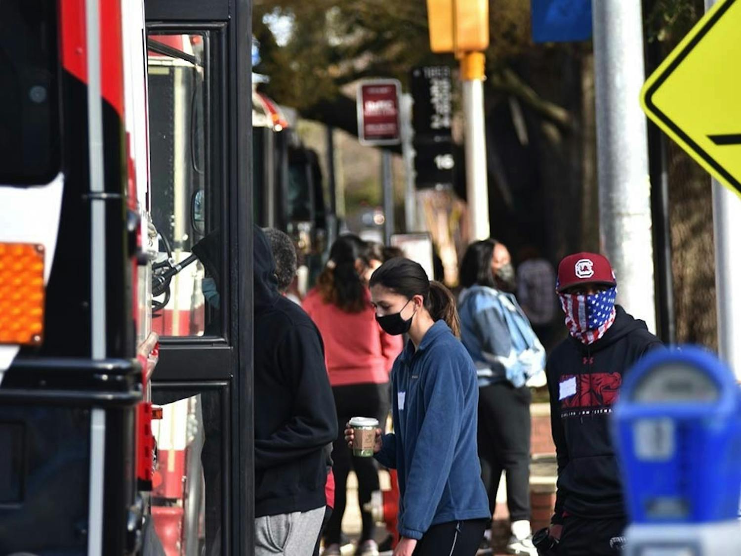 A Central Midlands Regional Transit Authority (COMET) shuttle parked at one of the designated stops around campus as students board the bus. A new rule requires students to swipe their CarolinaCard to board the University of South Carolina affiliated shuttles.
