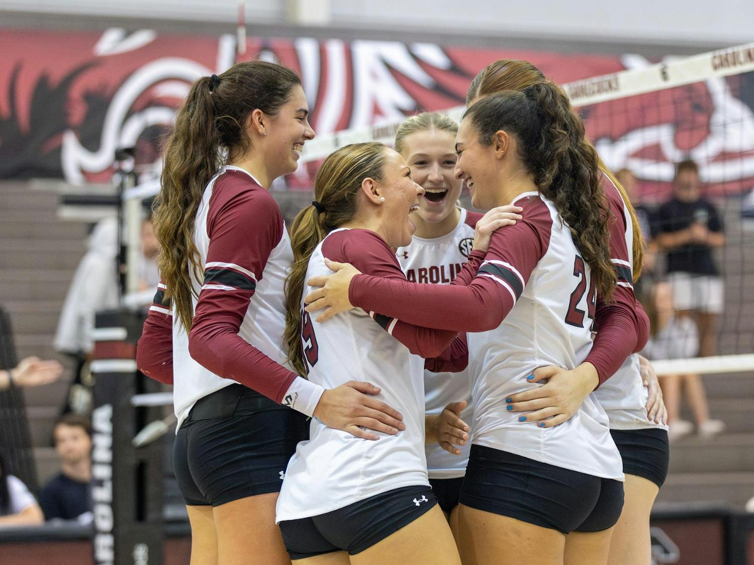The Gamecocks celebrate in a huddle after a successful point during the team's matchup against the Hatters at the Carolina Volleyball Center on Sept. 13, 2024. South Carolina’s 3-1 victory over Stetson marked the team’s sixth match victory this season.