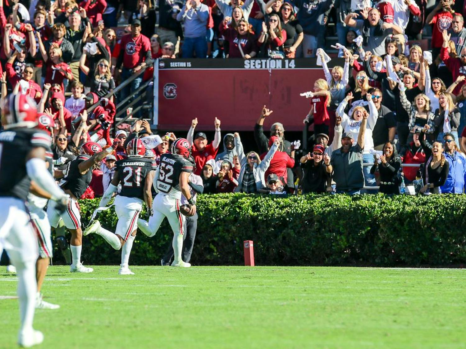 Fans cheer as sophomore linebacker Stone Blanton (right) scores off of a pick-six in the fourth quarter of the matchup between the South Carolina and Jacksonville State Gamecocks on Nov. 4, 2023. The pick six, along with several other turnovers in the second half allowed South Carolina to finish the game with a 38-28 lead.