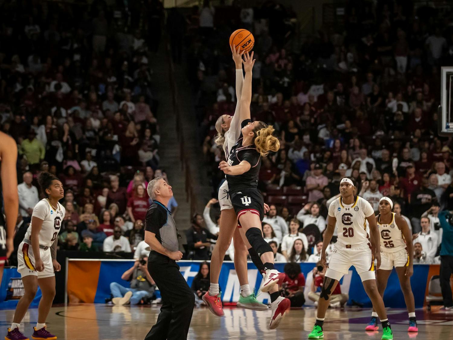Junior forward Chloe Kitts hits the tipoff away from the Indiana players on March 23, 2025. Kitts scored 10 points in the second half of the game.
