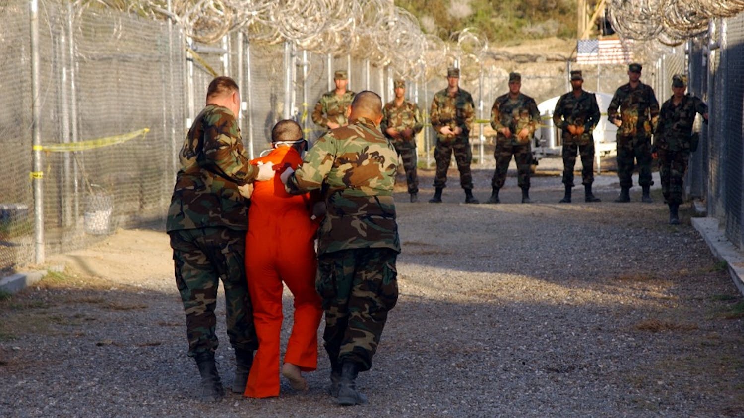 Taliban and al-Qaida detainees in orange jumpsuits sit in a holding area during in-processing to the temporary detention facility on Jan. 18, 2002, in Guantanamo Bay, Cuba. The Senate Select Committee on Intelligence released a report on the CIA's interrogation practices. The report said the CIA misled Americans and government policymakers about the effectiveness of the program that was secretly put into place after the 9/11 terror attacks. (Shane T. McCoy/ZUMA/TNS) 