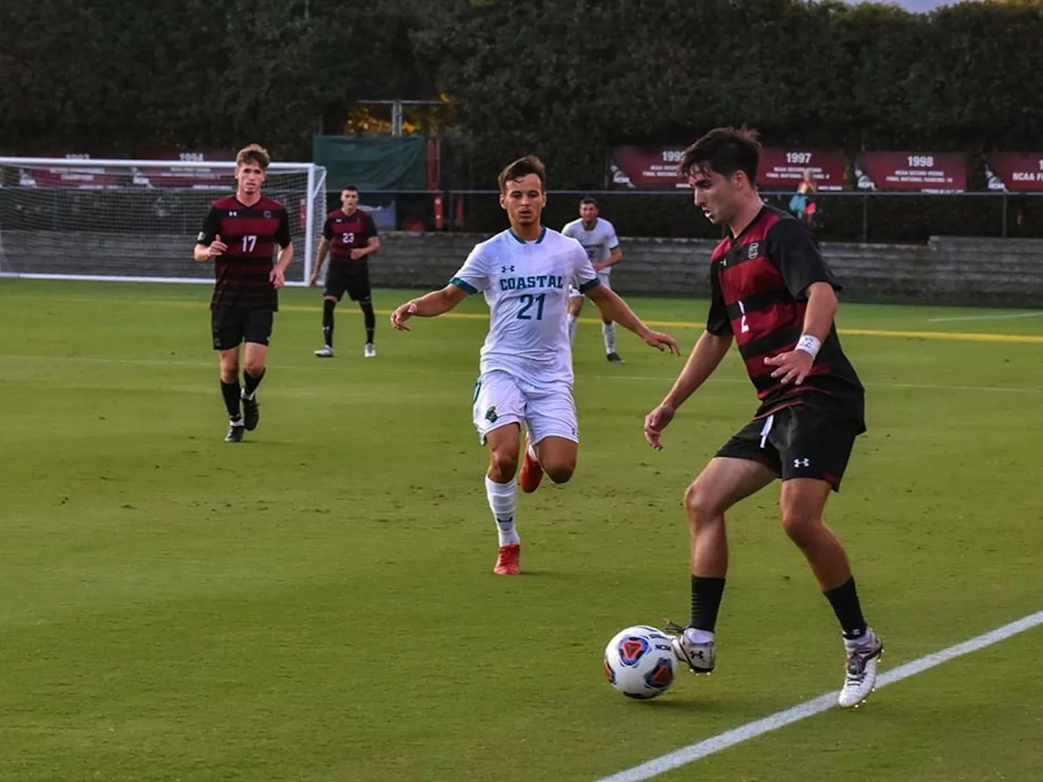 Gamecock junior forward Logan Frost watches sophomore Gamecock Justin Kopay take control of the ball. The Chanticleers beat the Gamecocks 4-1 in a match that saw only 10 Gamecocks on the field for the majority of the game.