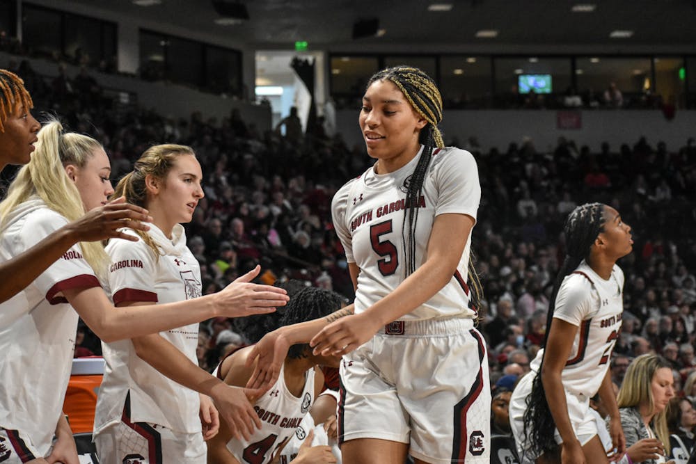<p>FILE—Senior forward Victoria Saxton high-fives her teammates before taking the bench. Saxton led the team in points, 19, in its SEC tournament game against Arkansas on Friday.</p>
