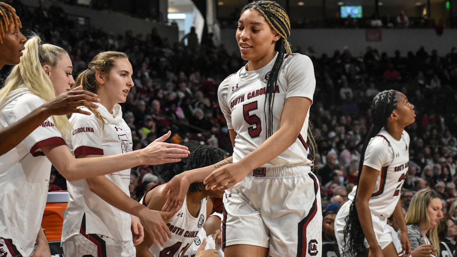 FILE—Senior forward Victoria Saxton high-fives her teammates before taking the bench. Saxton led the team in points, 19, in its SEC tournament game against Arkansas on Friday.